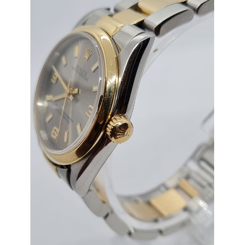 73 - Rolex Oyster Perpetual chronometer ladies watch with silver face and gold bezel,26mm case two tone s... 