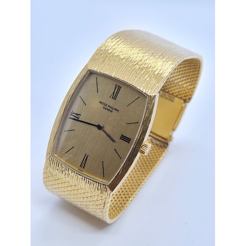 103 - 18k gold Patek Phillipe gent watch 1980s model, 28x22mm case and solid gold strap and 17cm long