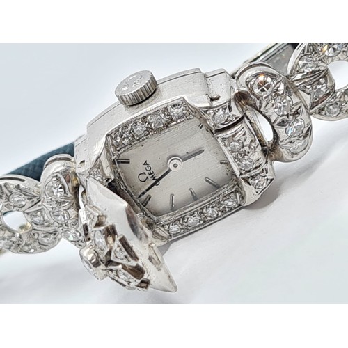 146 - Antique cocktail ladies watch in platinum and diamond setting, dial and movement and crown signed Om... 