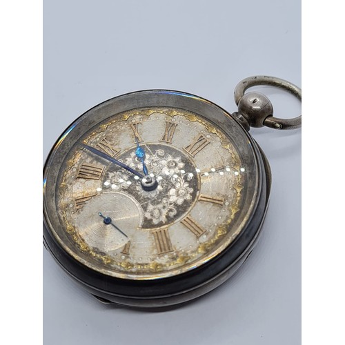 187 - Silver Pocket watch with ornate face and gold Roman Numerals rear wind circa 1880's, overwound