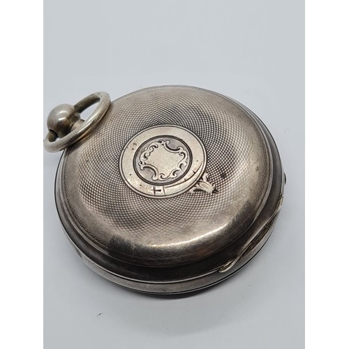 187 - Silver Pocket watch with ornate face and gold Roman Numerals rear wind circa 1880's, overwound