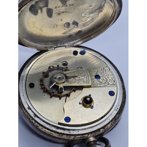 187 - Silver Pocket watch with ornate face and gold Roman Numerals rear wind circa 1880's, overwound