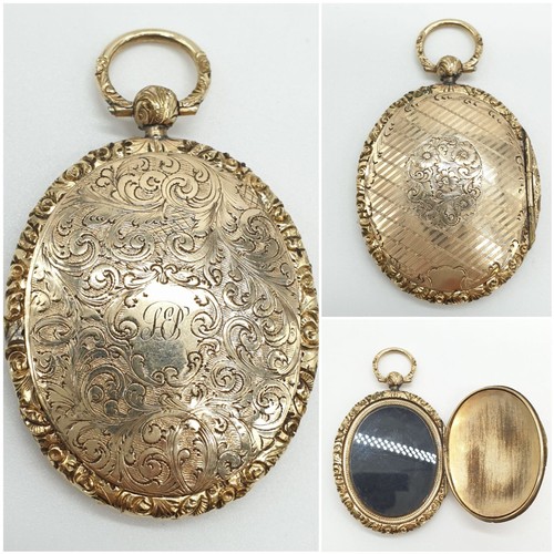 211 - Yellow metal large ornate Victorian locket, weight 23.9g and 6cm long approx