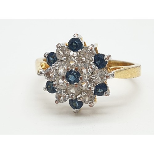 231 - 18ct gold stone set cluster ring, weight 3.5g and size S