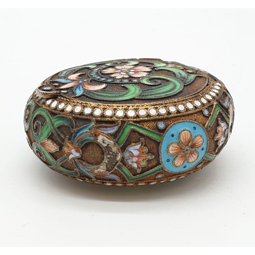 255 - Russian gilt enamel pill box with fitted lid surrounded by seed pearls and colourful enamel, 5cm dia... 