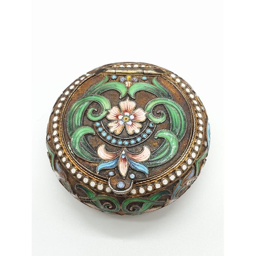 255 - Russian gilt enamel pill box with fitted lid surrounded by seed pearls and colourful enamel, 5cm dia... 