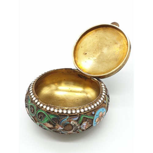 255 - Russian gilt enamel pill box with fitted lid surrounded by seed pearls and colourful enamel, 5cm dia... 