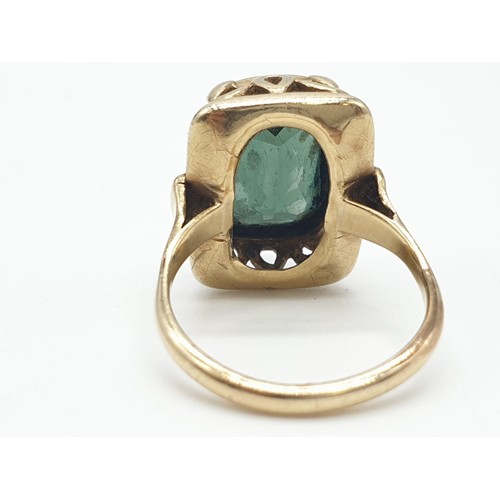 286 - Yellow metal (tested 14ct) ring with large tourmaline centre stone, size Q weight 5.9g