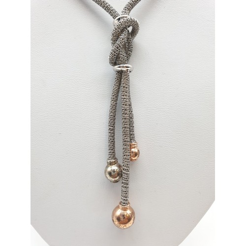 394 - Silver gilt knot style necklace, chain 49cm long and the drop is 9cm long, weight 22.71g approx