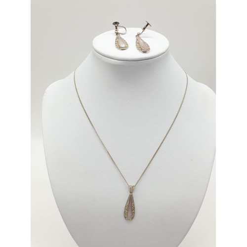 418 - Silver jewellery set to include pendant on chain and matching pair of earrings. 
Mother of pearl des... 