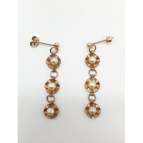 430 - Yellow metal antique pair of pearl drop earrings floral design, weight 1.84g and 4cm long approx