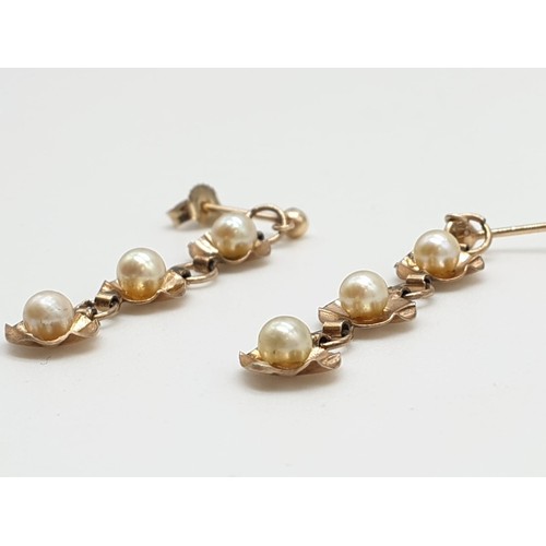 430 - Yellow metal antique pair of pearl drop earrings floral design, weight 1.84g and 4cm long approx