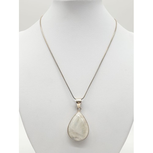 438 - Large moonstone pendant on 40cm long silver chain, weight 17.77g and stone size 35x24mm approx