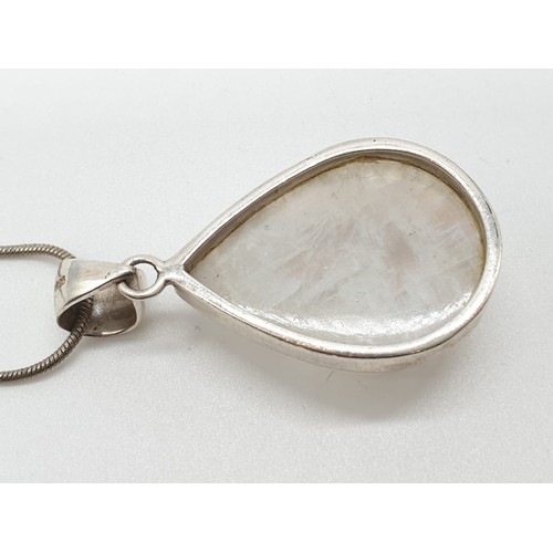 438 - Large moonstone pendant on 40cm long silver chain, weight 17.77g and stone size 35x24mm approx