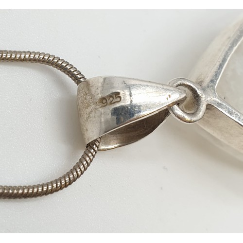 438 - Large moonstone pendant on 40cm long silver chain, weight 17.77g and stone size 35x24mm approx