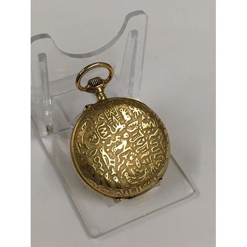 139 - Rare unusual yellow metal pocket watch with Egyptian hieroglyphs on the case , winds and ticks but n... 