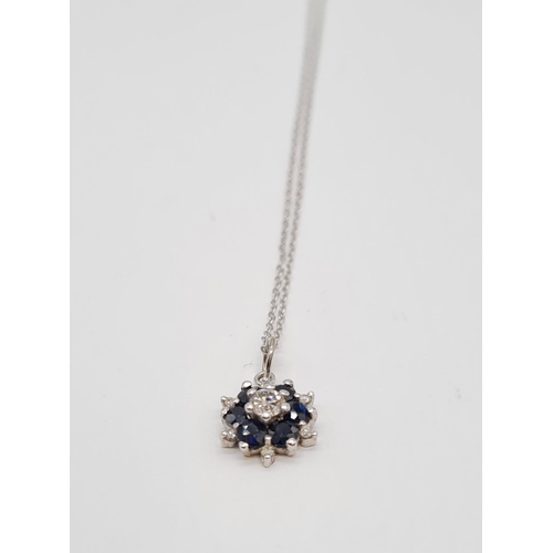 214 - 18ct gold with sapphire and diamond set pendant on 46cm long 9ct gold chain, weight 1.58g approx