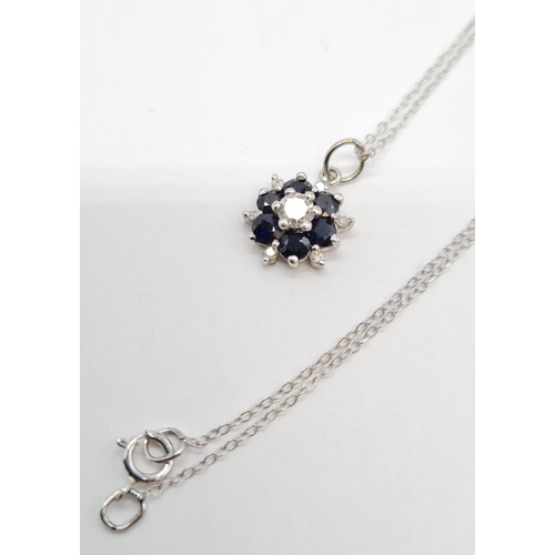 214 - 18ct gold with sapphire and diamond set pendant on 46cm long 9ct gold chain, weight 1.58g approx