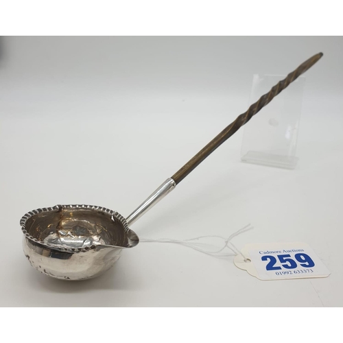 259 - George III silver Ladle with Coin set in the bottom of the bowl, dated 1787, some damage 28g 32cms