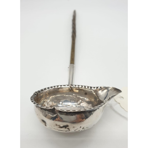 259 - George III silver Ladle with Coin set in the bottom of the bowl, dated 1787, some damage 28g 32cms