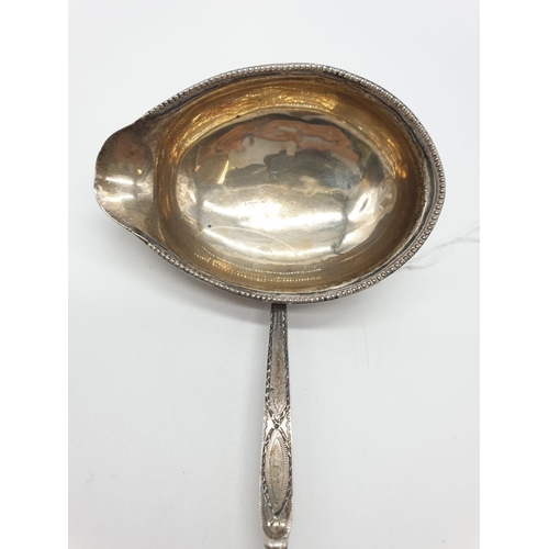 261 - Georgian Silver Punch Ladle 46g 38cms long with ornate handle and beaded bowl