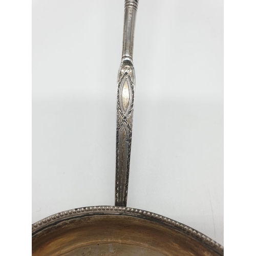 261 - Georgian Silver Punch Ladle 46g 38cms long with ornate handle and beaded bowl