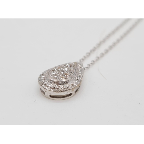 266 - 18k gold and diamond set pendant on a 40cm 9ct gold chain, weight 2g