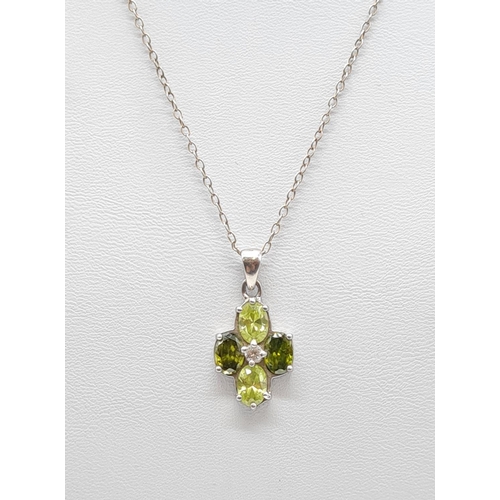 332 - Peridot and citrine silver pendant on a 40cm long silver chain, weight 4.79g and pendant size 20x13m... 