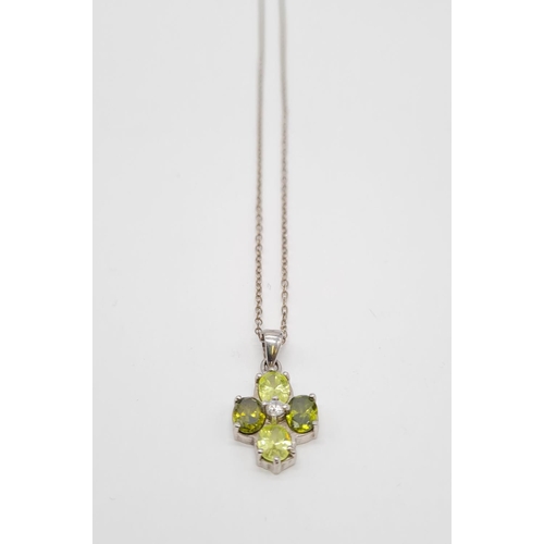 332 - Peridot and citrine silver pendant on a 40cm long silver chain, weight 4.79g and pendant size 20x13m... 