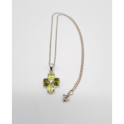 332 - Peridot and citrine silver pendant on a 40cm long silver chain, weight 4.79g and pendant size 20x13m... 