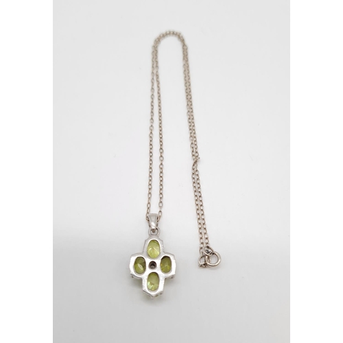 332 - Peridot and citrine silver pendant on a 40cm long silver chain, weight 4.79g and pendant size 20x13m... 