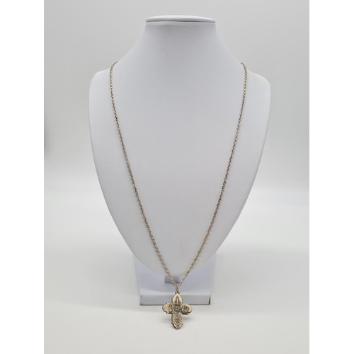 352 - Vintage silver cross set on a 62cm long silver linked chain, weight 9.79g and pendant 3cm long