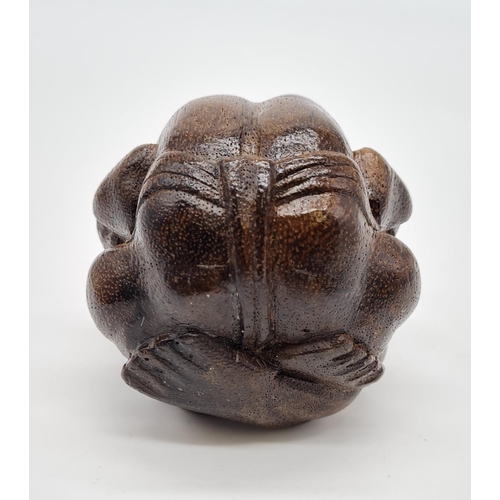 478 - Carved Wooden Effigy of a Buddhist Monk in Contemplation. 7cm diameter