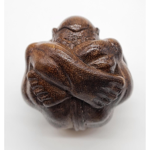 478 - Carved Wooden Effigy of a Buddhist Monk in Contemplation. 7cm diameter