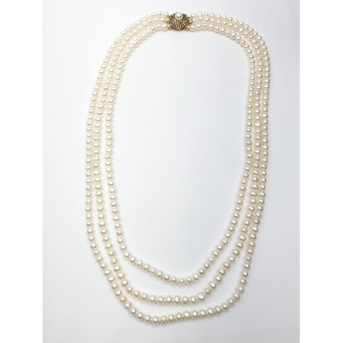 106 - 3 rows of Cultured pearl necklace set in 9ct gold clasp , weight 49g and 46cm long approx