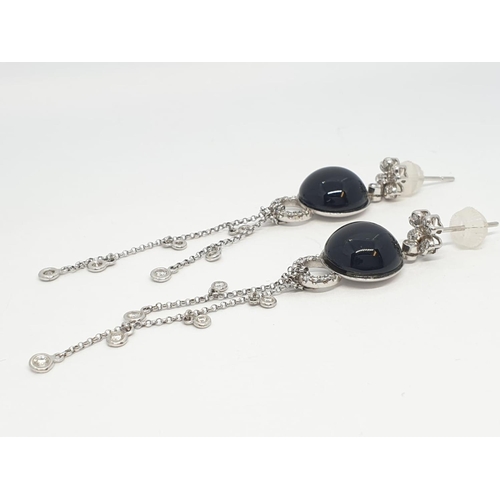 109 - Pair of Onyx and diamond drop earrings set in 18ct gold, weight 10.13g and 7cm drop approx