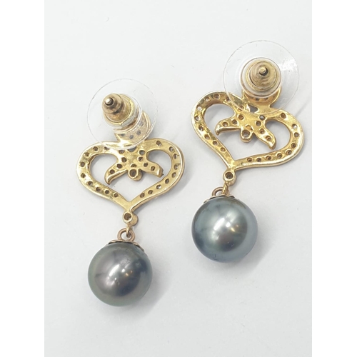 128 - Pair of South sea pearl earrings set in rose diamonds , 3cm drop and pearl size 8mm approx