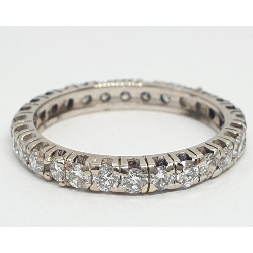 204 - Diamond full eternity ring (tested 18ct gold), weight 2.27g and size J