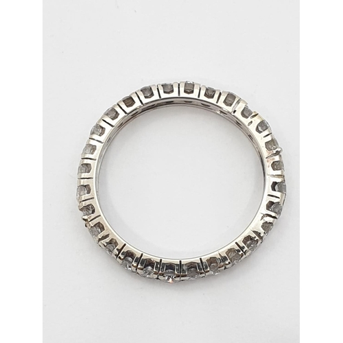 204 - Diamond full eternity ring (tested 18ct gold), weight 2.27g and size J