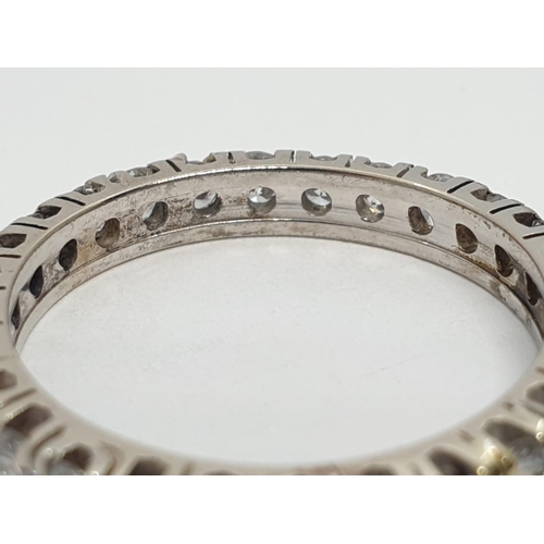 204 - Diamond full eternity ring (tested 18ct gold), weight 2.27g and size J