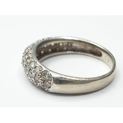 206 - 18ct white gold diamond half eternity ring, weight 2.6g and size L