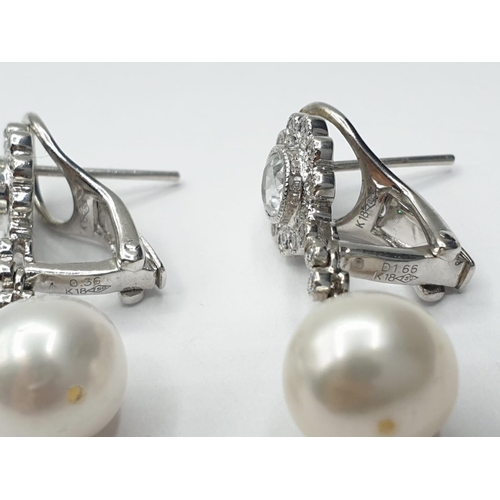 216 - Pair of 18ct gold pearl and white sapphire drop earrings in floral design, weight 6g and 2.5cm drop ... 