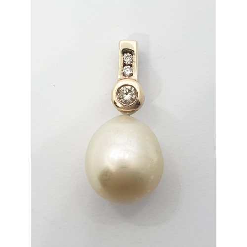 256 - Large pearl pendant set in diamond and 9ct gold, weight 3.21g and pearl size 15mm approx