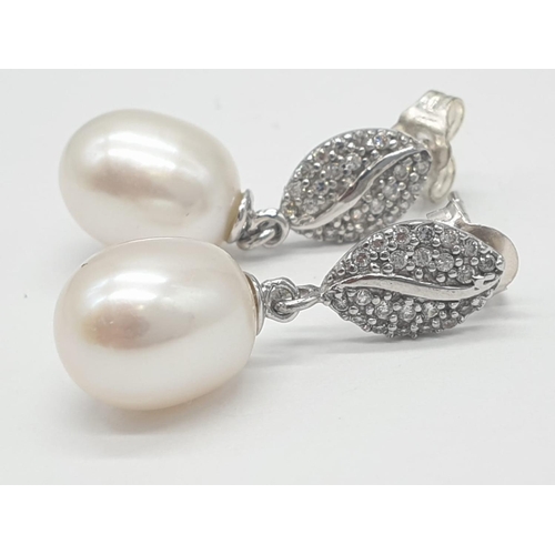 374 - 2x pairs of silver pearl drop earrings, weight 5.52g  (1 back missing)