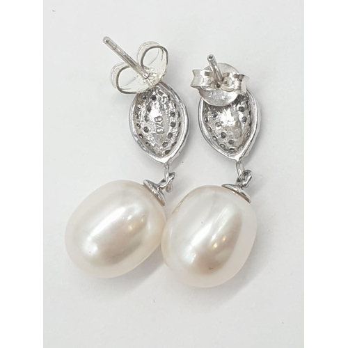 374 - 2x pairs of silver pearl drop earrings, weight 5.52g  (1 back missing)