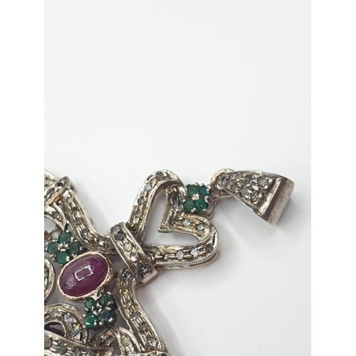 668 - Ruby, diamond and emerald on silver PENDANT. 19.7g   5.4cm  6cm drop.