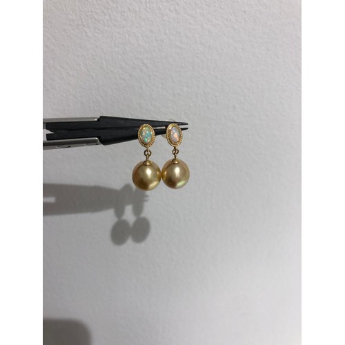 650 - South Sea gold pearl studs in 18k gold with opals; each pearl of top quality and around 9mm