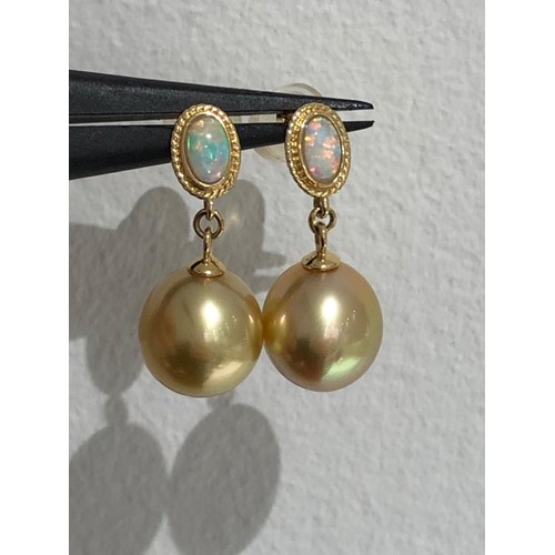 650 - South Sea gold pearl studs in 18k gold with opals; each pearl of top quality and around 9mm