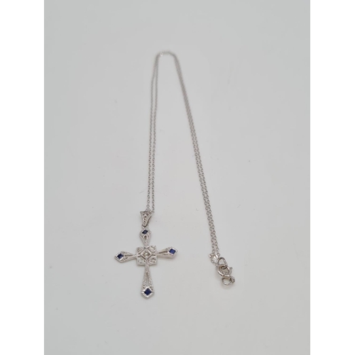 142 - Art deco style sapphire and diamond cross pendant set in 18ct gold, on a 46cm long 9ct gold chain, t... 