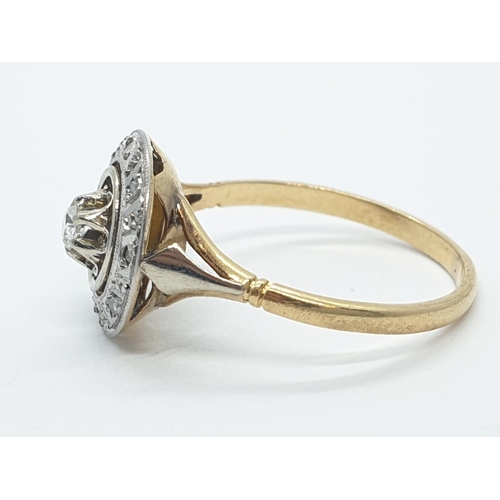 202 - An antique Art Deco diamond halo ring set in yellow metal shank (1 stone missing), weight 2g and siz... 